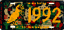 Same license 
plate with 
a static-adhered clear overlay silkscreened in yellow with the year 
1992 & a puffin with a rose in it's mouth overlayed upon it.